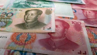 Obraz przedstawia banknot juana chińskiego .